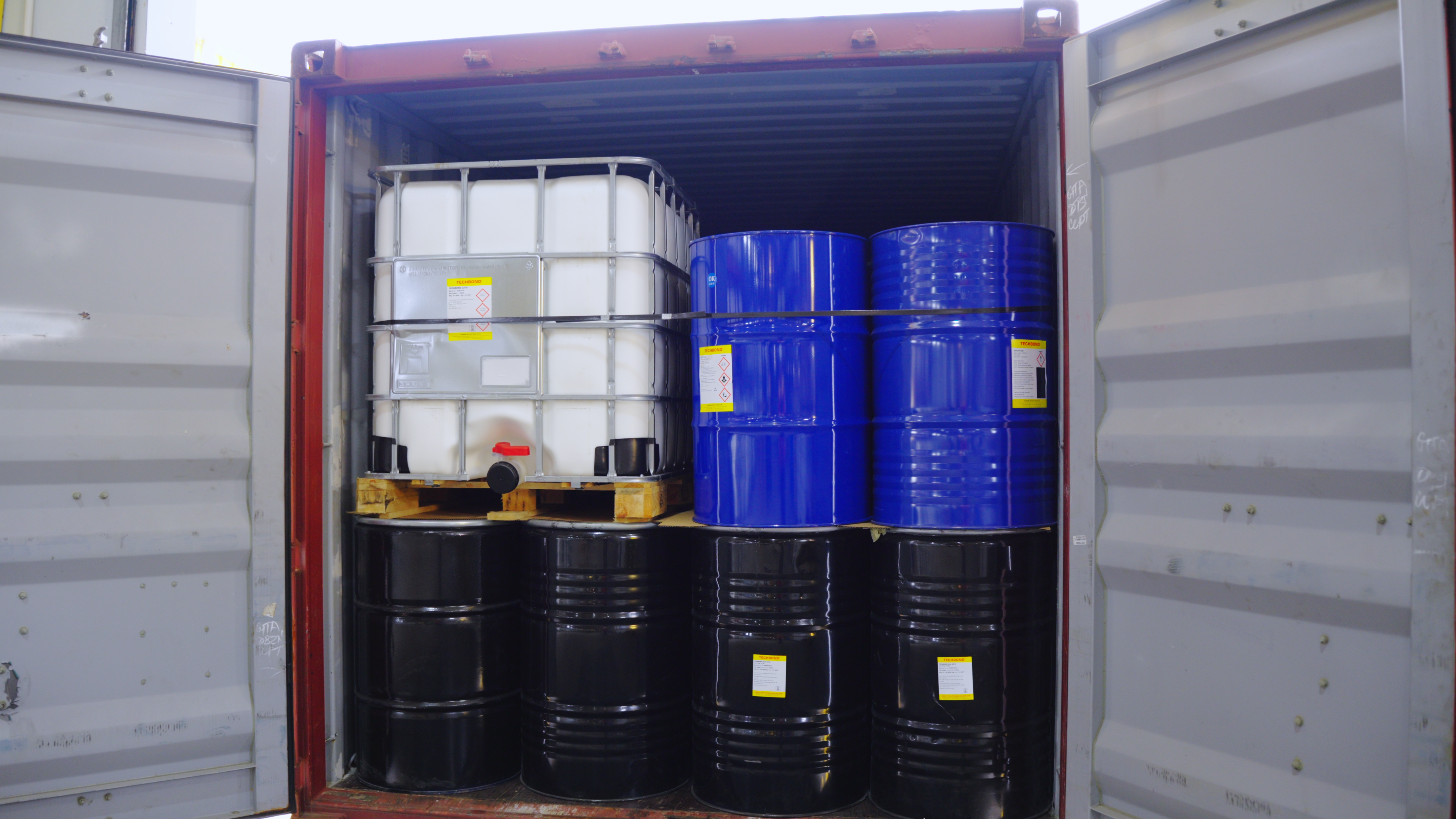 TECHBOND IBC tanks and drums loaded inside an export container