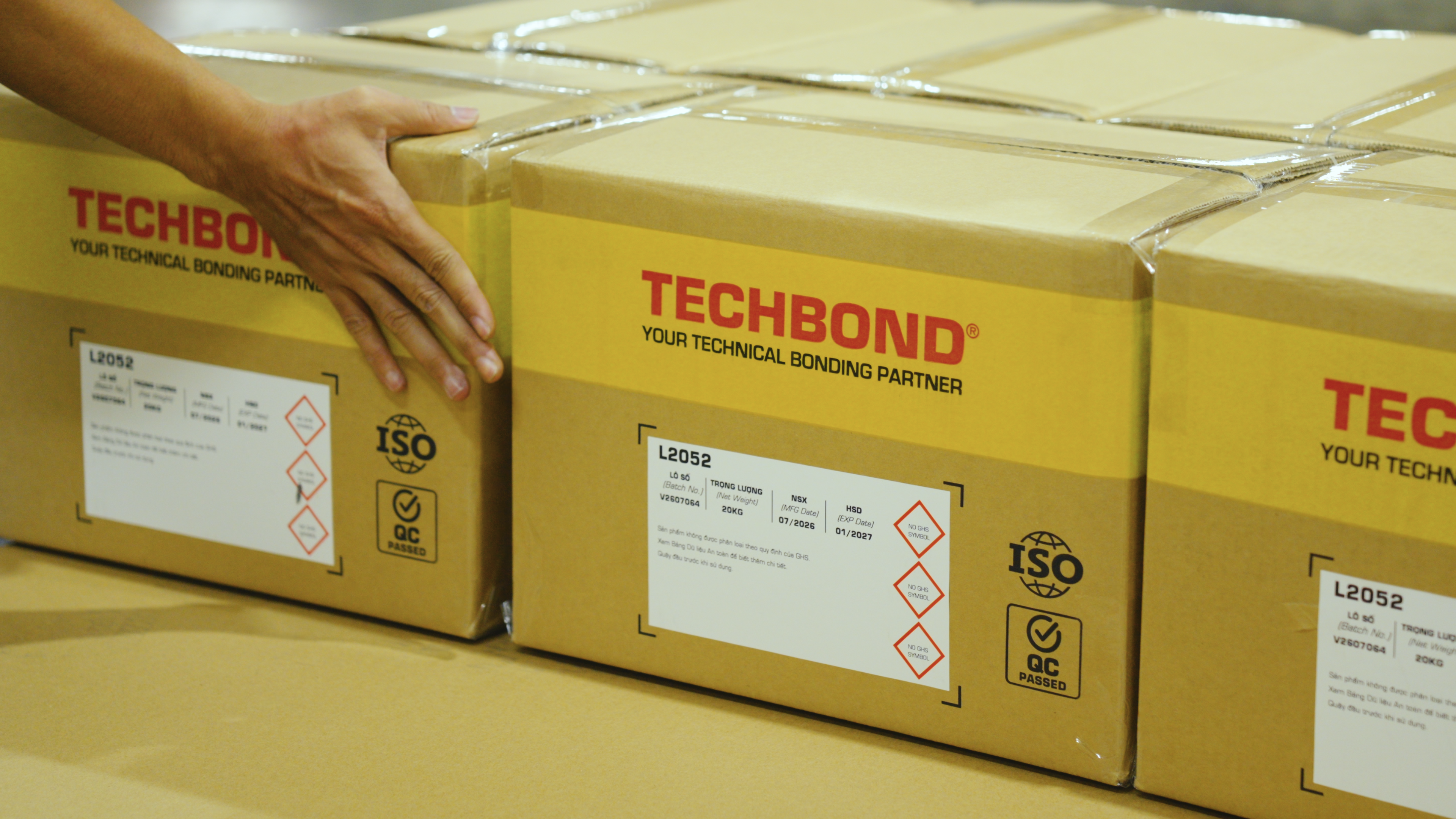 Sealed and labelled TECHBOND product cartons prepared for shipment